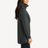 Side view of women’s gray long waterproof rain shell on model – Louvóre apparel